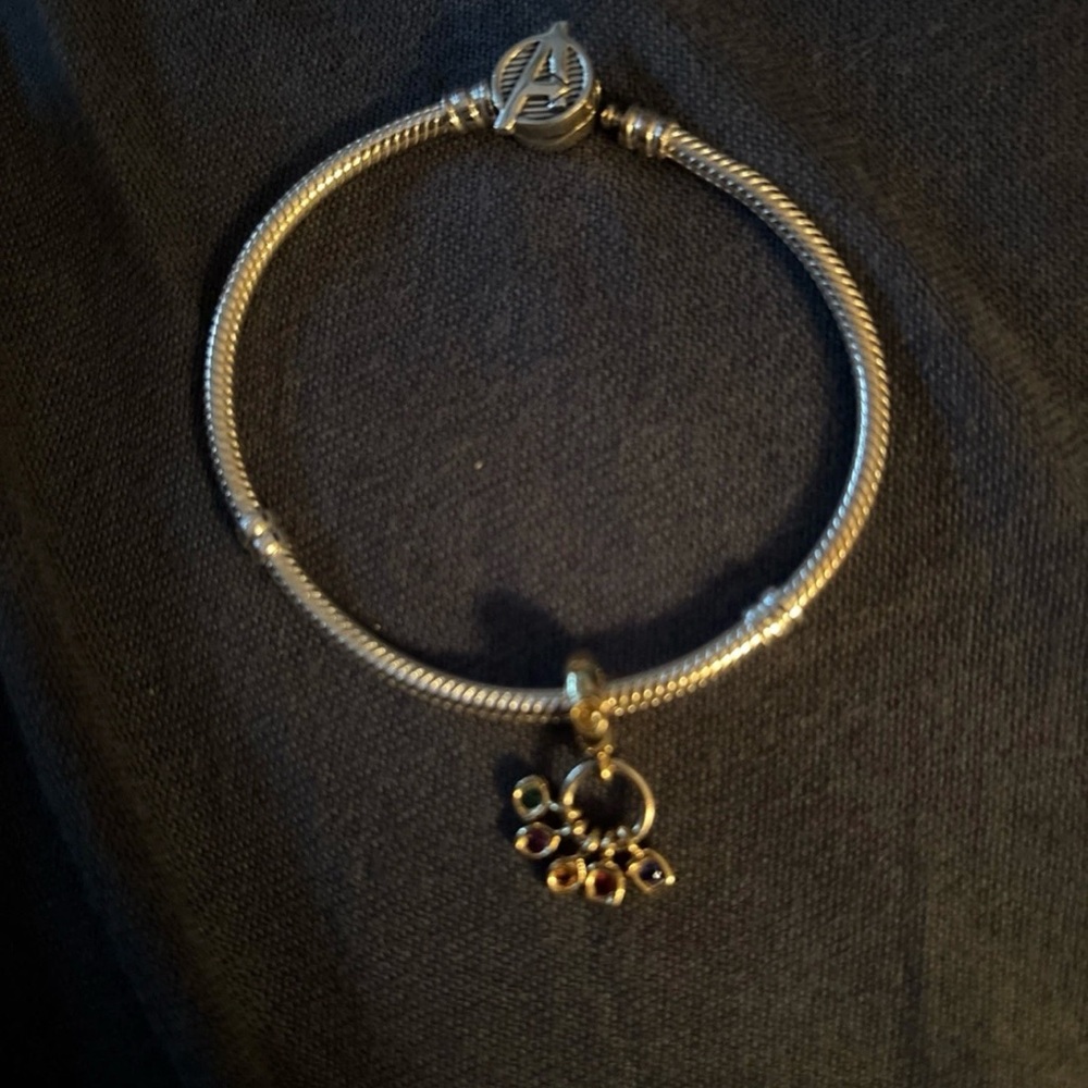 Pandora Silver Bracelet with Avengers infinity stone charm .